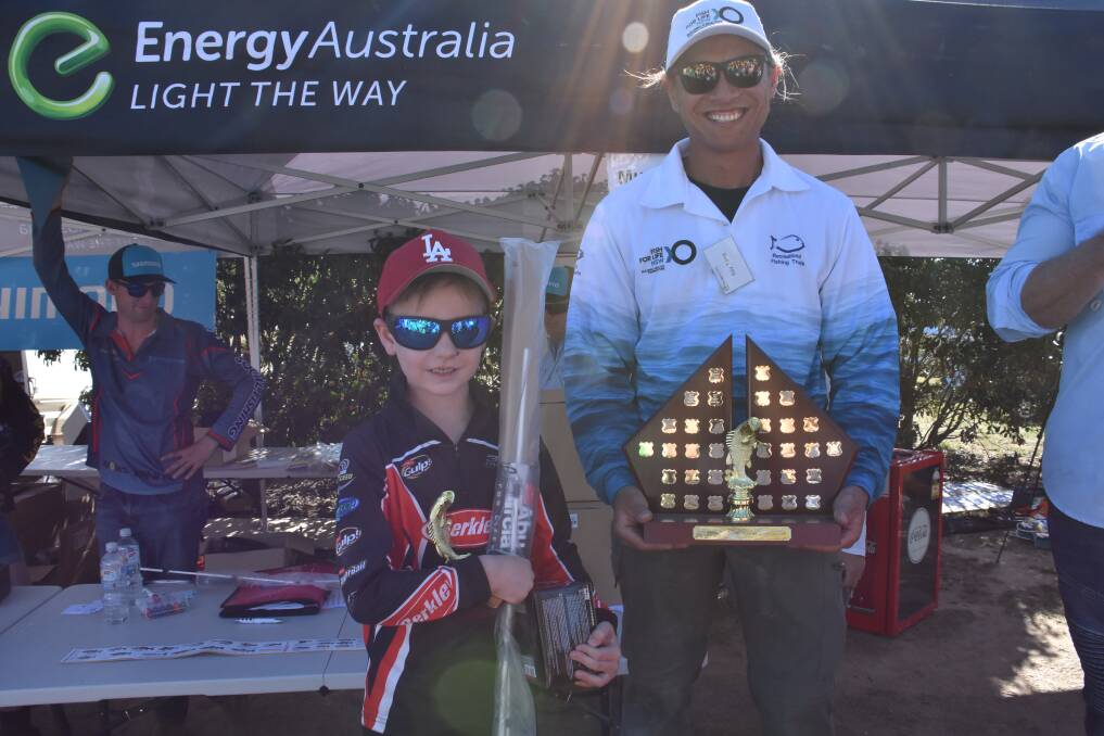 JUNIOR ANGLER: Connor Williams (left) took home the big trophy for catching the biggest trout in the competition at 58cm. Picture: ALANNA TOMAZIN. 