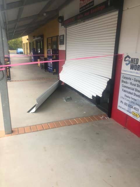 DAMAGE: The front roller door as it was left following the break-in. Picture: SUPPLIED. 