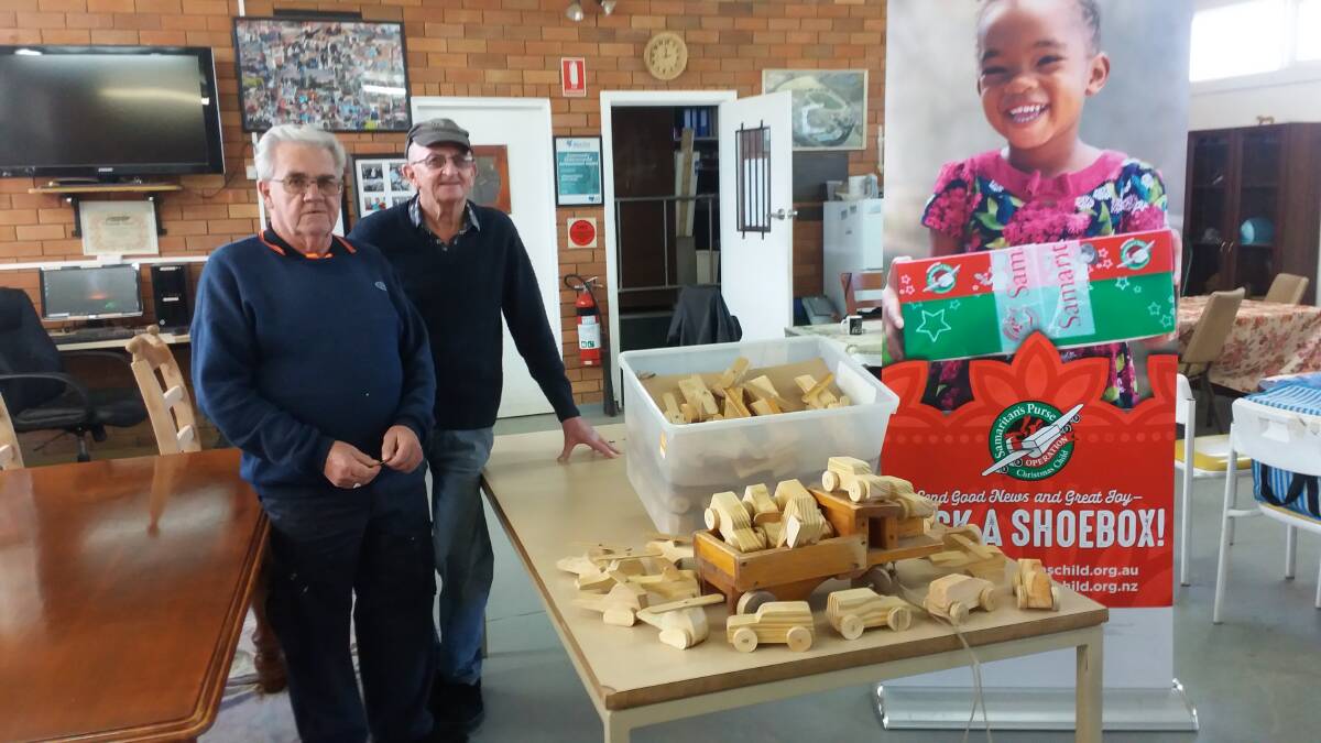 DONATION: Lithgow Men's Shed's Tom Bradford and John Green deliver their donations to Operation Christmas Child. 