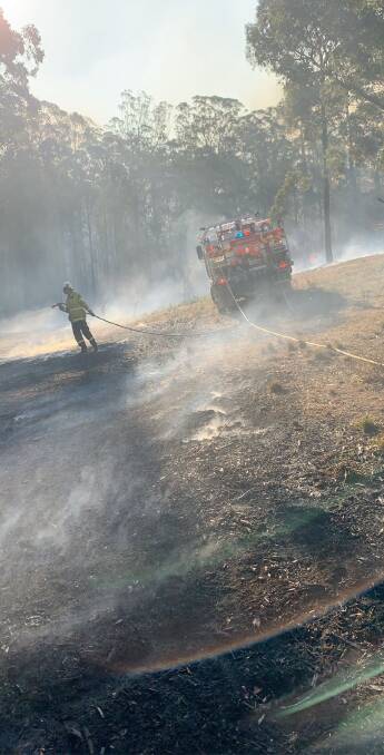 FIRE: Marrangaroo rural bush fire brigade members as they work to contain a blaze near Taree. Picture: MARRANGAROO RFS. 