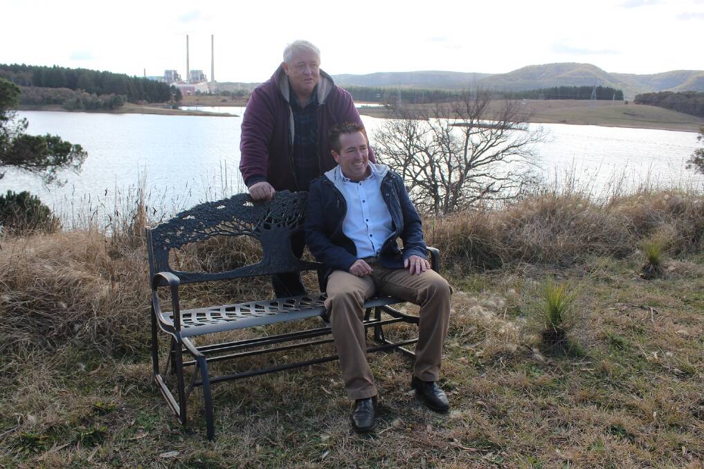 SUPPORT: Bruce Ryan and MP Paul Toole with a new bench recently installed at the site. 