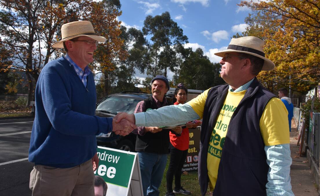 VICTORY: Re-elected Calare MP Andrew Gee is greeted by supporter John Lowe at the Cooerwull Public School booth. Picture: KIRSTY HORTON. 