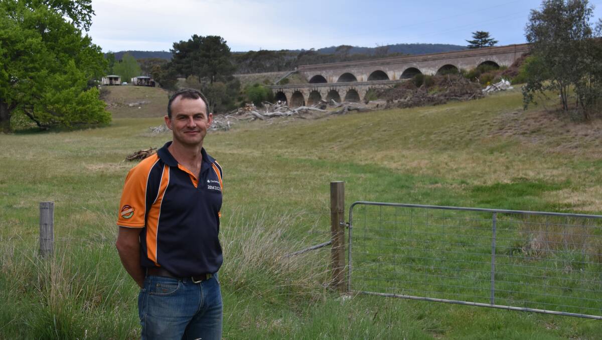 WINNER: Full time coal miner and part time artist Shane Monaghan near his inspiration, the iconic Zig Zag Railway bridges. Picture: ALANNA TOMAZIN.