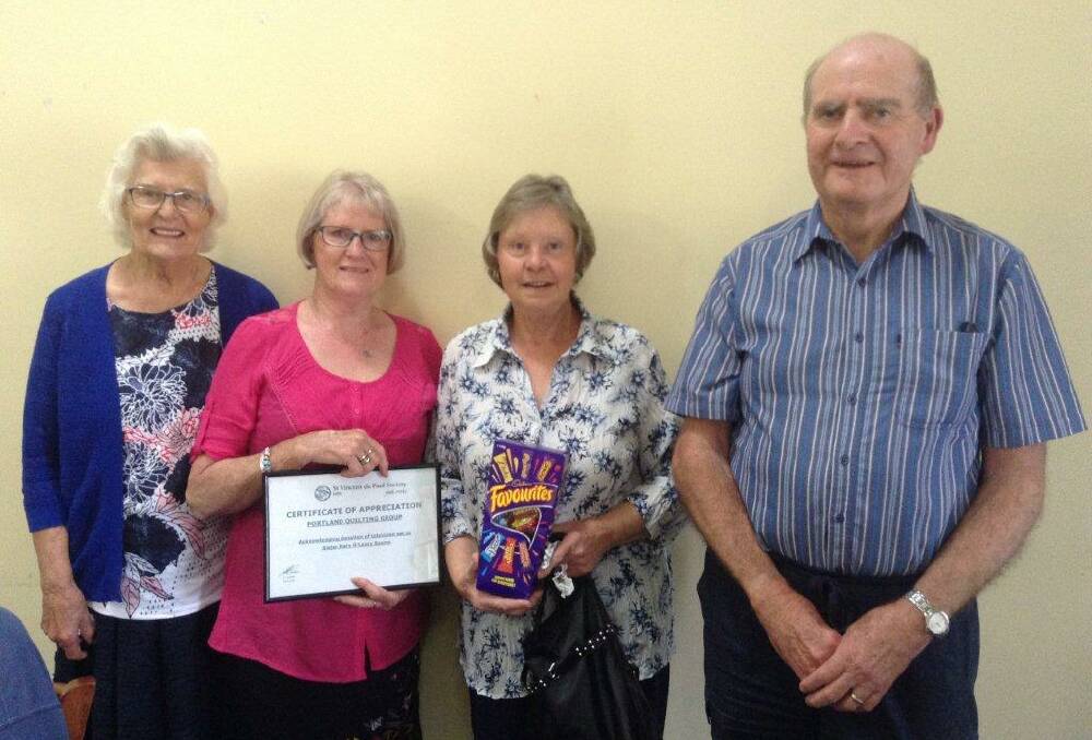 BOOST: Mary O'Leary centre coordinator Pat Wilkinson, Portland Community Quilters Rita Kinross and Roslyn Micallef with local St Vincent de Paul president John Kearns. Picture: SUPPLIED. 