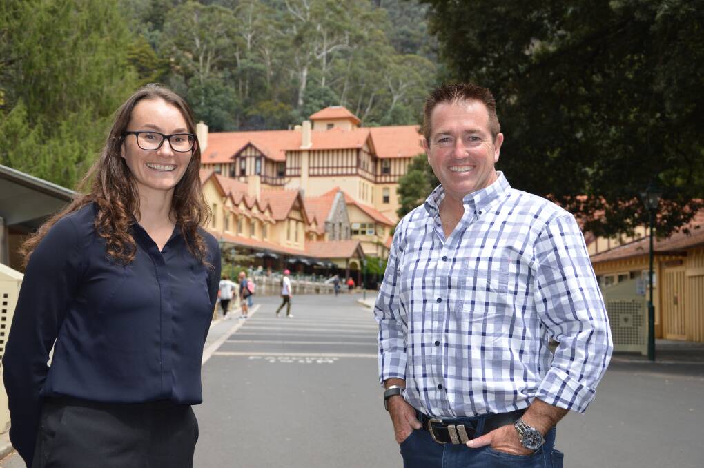 EXCITING TIMES: Jenolan Caves GM Jodie Anderson with Bathurst MP Paul Toole outside the iconic Caves House which is set for a $10.4 million makeover thanks to the NSW Government. Picture: SUPPLIED. 