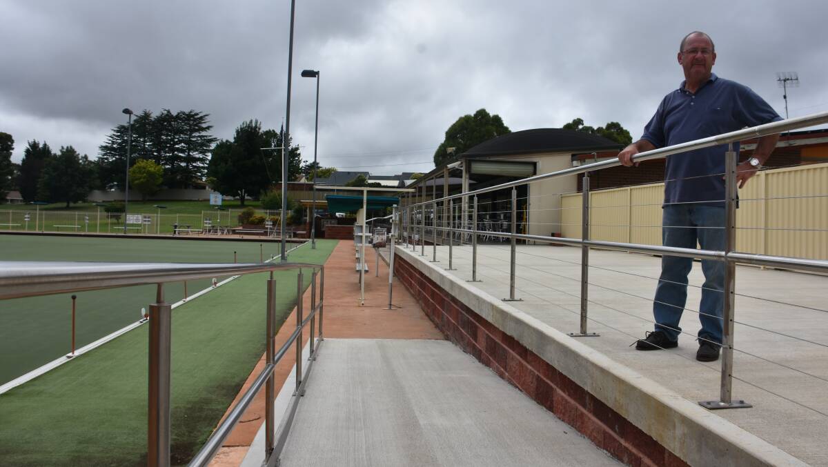 Wallerawang Community and Sports Club Secretary Stephen Jackson with the new railing created by the Men's Shed. 