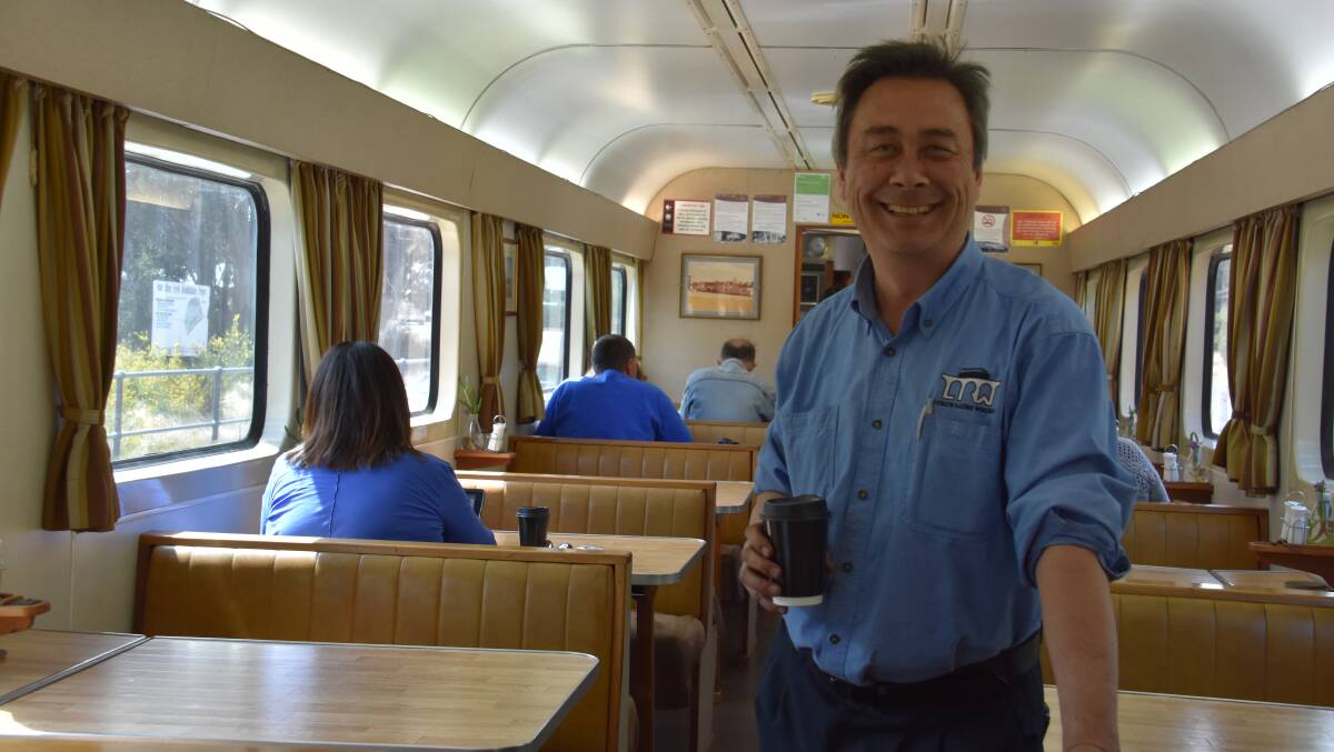 Lithgow Railway Workshop director Tim Elderton grabs a cuppa in the heritage train at State Mine. 