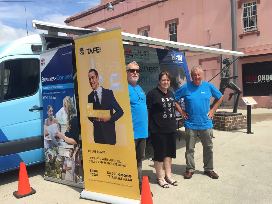 ON HAND FOR ADVICE: Bus hosts George Nowak and Ken Breen with Lithgow TAFE's Jacki Risby. Picture: KIRSTY HORTON. 