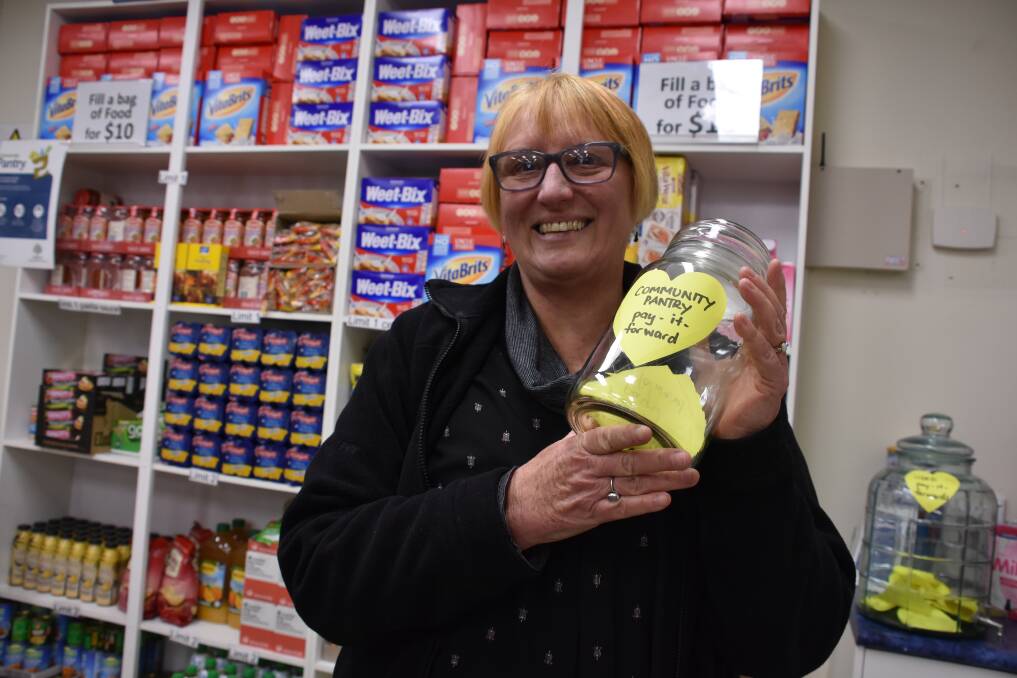 ADDRESSING A NEED: Anglicare Lithgow volunteer Bronwyn Webb with the Pay It Forward jar. Picture: KIRSTY HORTON.