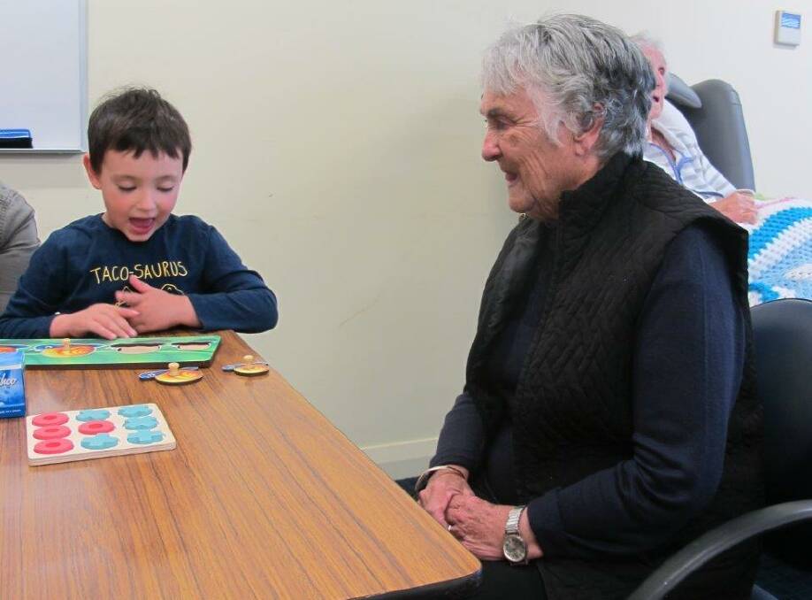 James enjoys his game with a resident at Tabulum. Pictures: SUPPLIED. 