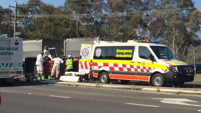 Emergency services work to free a person trapped after a crash at Marrangaroo. Picture: LITHGOW MERCURY. 