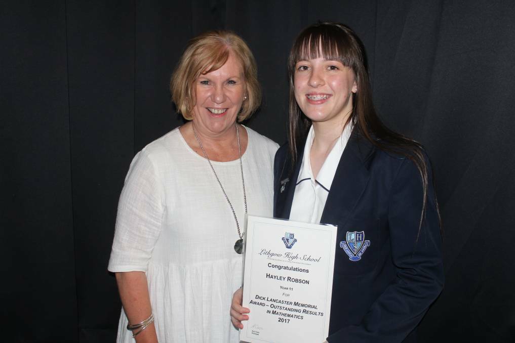 Hayley Robson is presented with the Dick Lancaster Memorial Award for outstanding results in Mathematics presented by Toni MacDonald, Director of Schools.