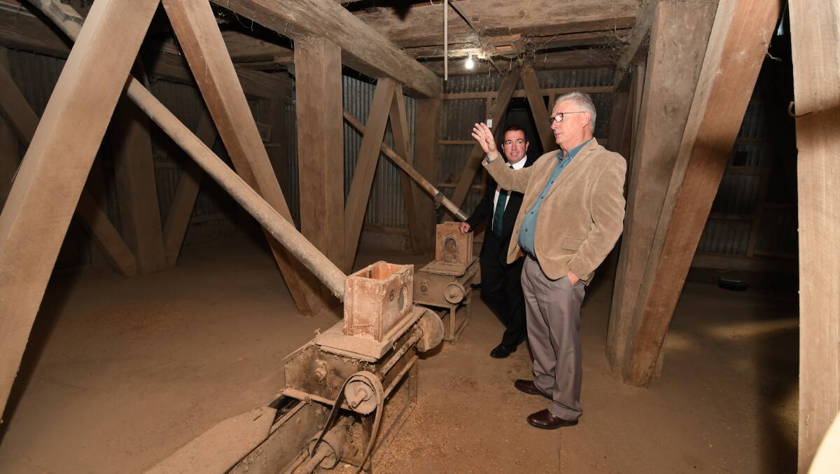STATE GRANT: Tremain's Mill owner Stephen Birrell (right) explaining to Bathurst MP Paul Toole the workings of the former mill. Photo: CHRIS SEABROOK. 