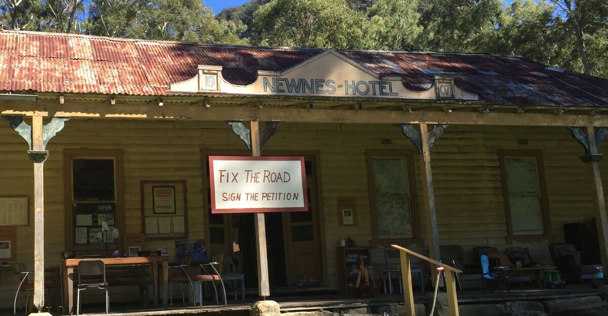 FIX THE ROAD: The sign on the Newnes Hotel at the campground urging people to sign a petition. 
