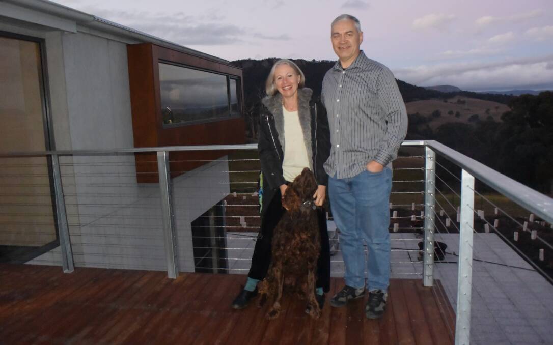 SUNSET: Helen and Robert Swinton on the deck of their recently renovated South Bowenfels gem. Picture: KIRSTY HORTON. 