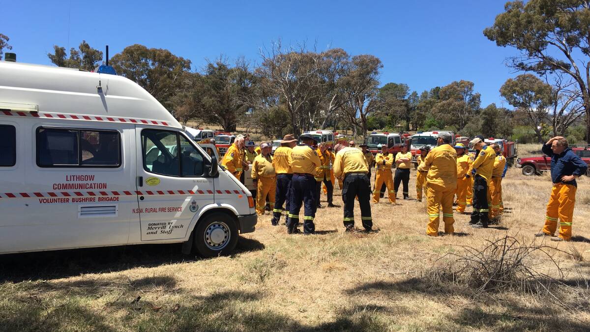 HARD AT WORK: Rural Fire Brigade volunteers gather at Tarana. Pictures: SUPPLIED.