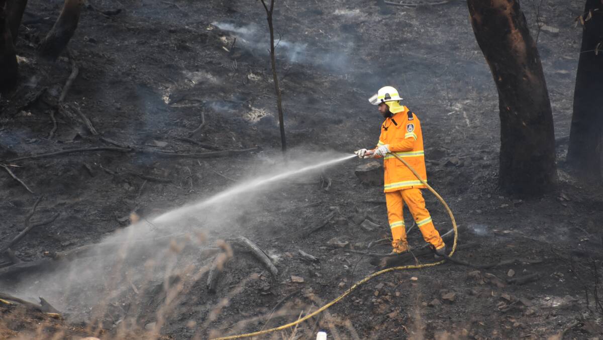 Fire-fighters at the scene of the Lidsdale fire. Picture: KIRSTY HORTON. 