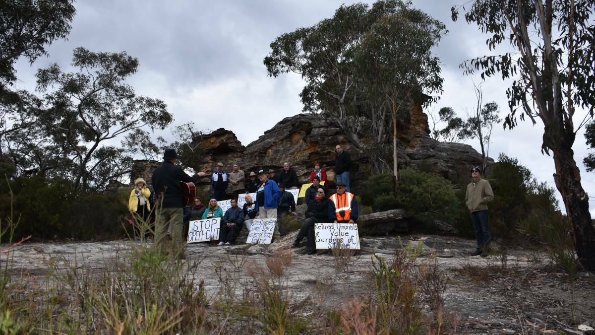 CHANGE: Members of CRUMA with Lithgow Environment Group's Peter Drinkall on a pagoda at Dobbs Drift Lookout earlier this year. Picture: PHOEBE MOLONEY.
