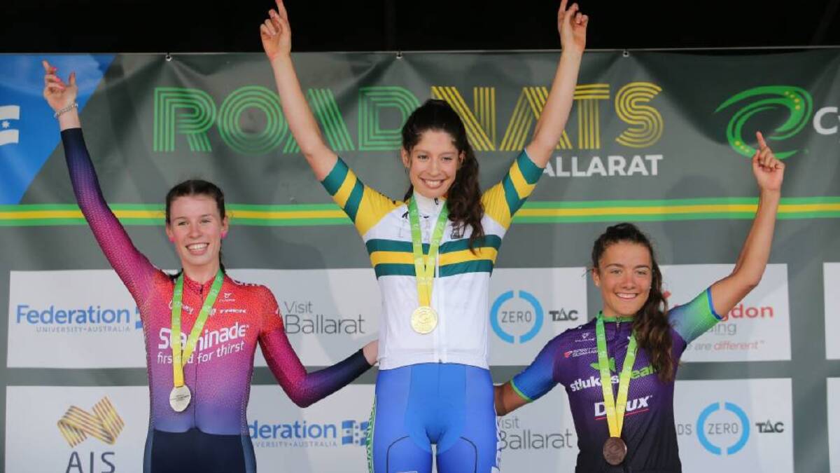 HAPPY MOMENT: Emily Watts (left) enjoys her moment on the under 23s podium after clinching criterium silver. Photo: JOHN VEAGE. 