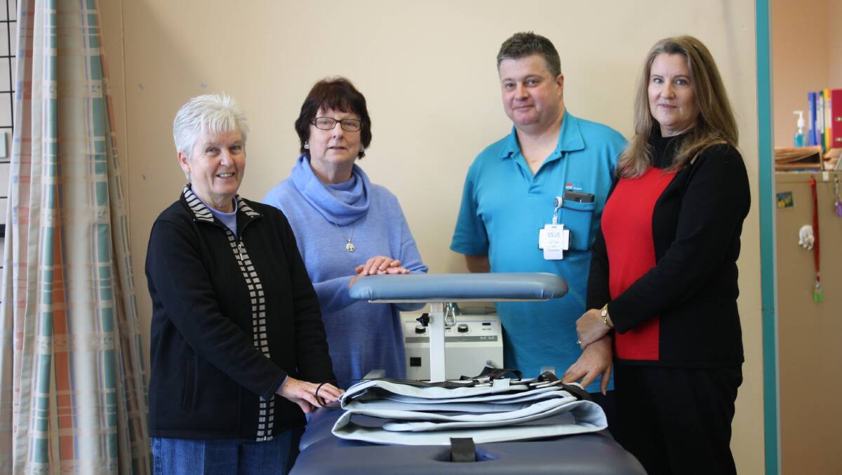 A LASTING IMPACT: Lithgow Hospital Auxiliary members Linda Shreeve, Margaret Buckley and Linda Lingard with physiotherapist David Short and the new traction unit. Picture: SUPPLIED. 