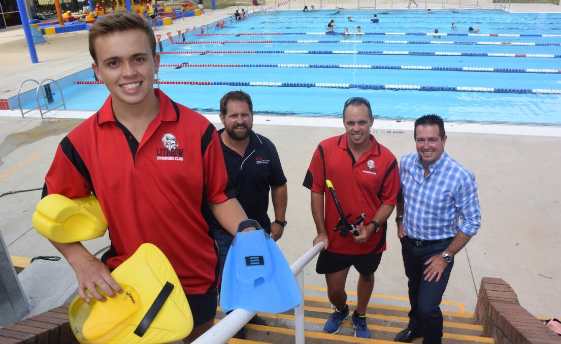 NEW GEAR ON THE WAY: Lithgow Swimming Club's Logan McManus, Pete Evans, Craig McManus and Bathurst MP Paul Toole. Picture: KIRSTY HORTON. 