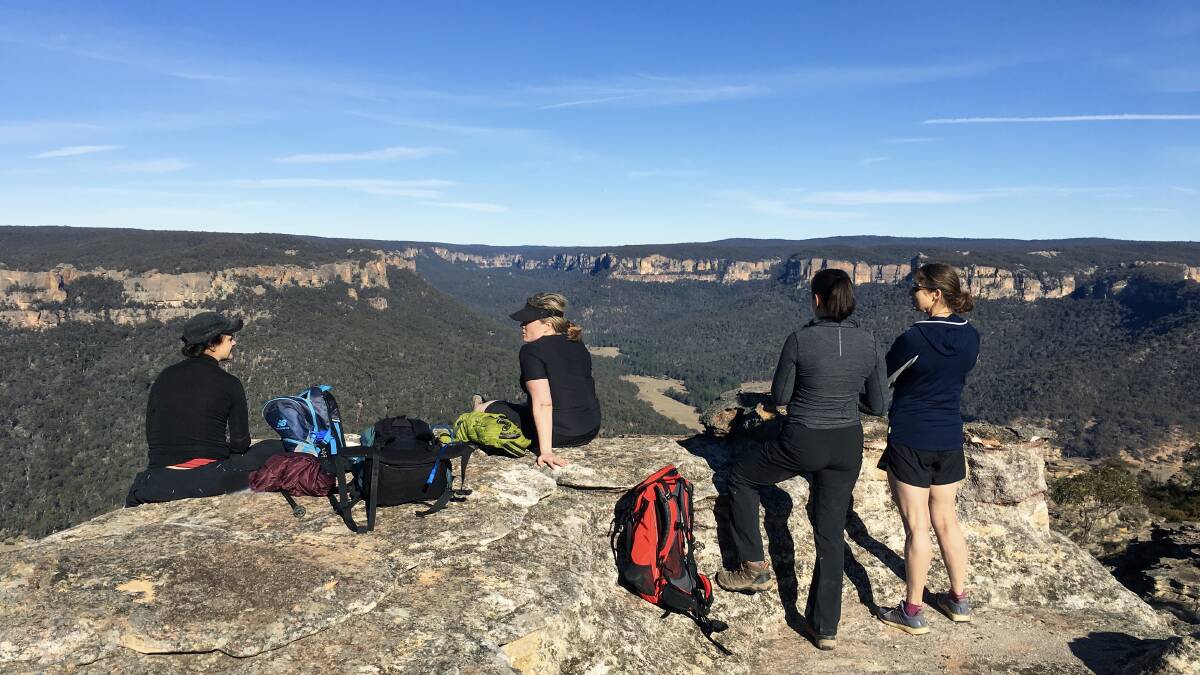 VIEW: Wolgan Valley Eco Tours clients enjoy panoramic views on the 'Donkey Mountains Hike'. Picture: KRISTIE KEARNEY. 