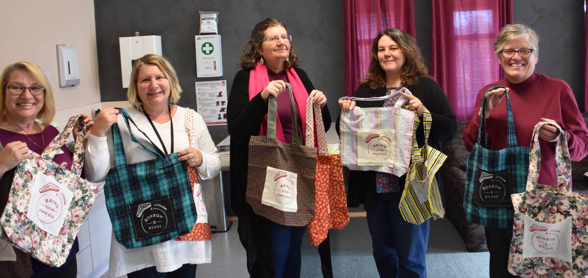 CREATIVE BAGS: Carol Stevens, Debbie Bailey, Amanda Horner, Deb Oakley and Allyn Jory show off some of the bags they have created with second hand material. Picture: CIARA BASTOW. 