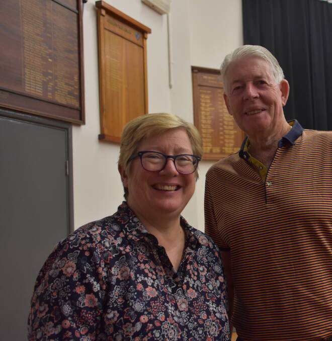 SUPPORT: Lithgow High School principal Ann Caro and school patron Phil Duncan in front of the board honouring his scholarship students. 