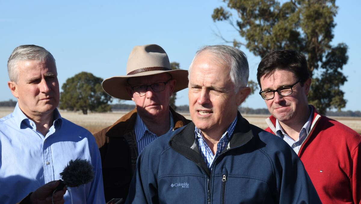 DRY: Prime Minister Malcolm Turnbull was accompanied by Deputy Prime Minister Michael McCormack, Minister for Agriculture and Water Resources David Littleproud and Member for Parkes Mark Coulton to announce the drought-relief drought support. Photo: AMY MCINTYRE 