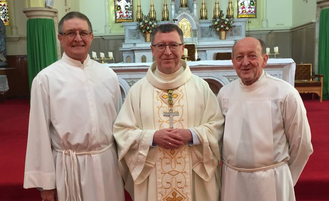 A FIRST FOR THE DIOCESE: Charles Applin (left) and Terry Mahony with the Bishop of Bathurst Michael McKenna (centre).