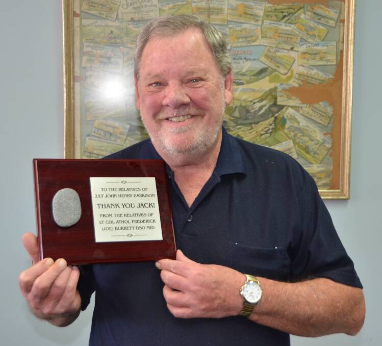 HEROISM AND SURVIVAL: Portland’s Ian Burrett with a plaque bearing an Anzac Cove beach pebble that he
yesterday presented to a descendant of a man who saved his father’s life at Lone Pine 100 years ago.