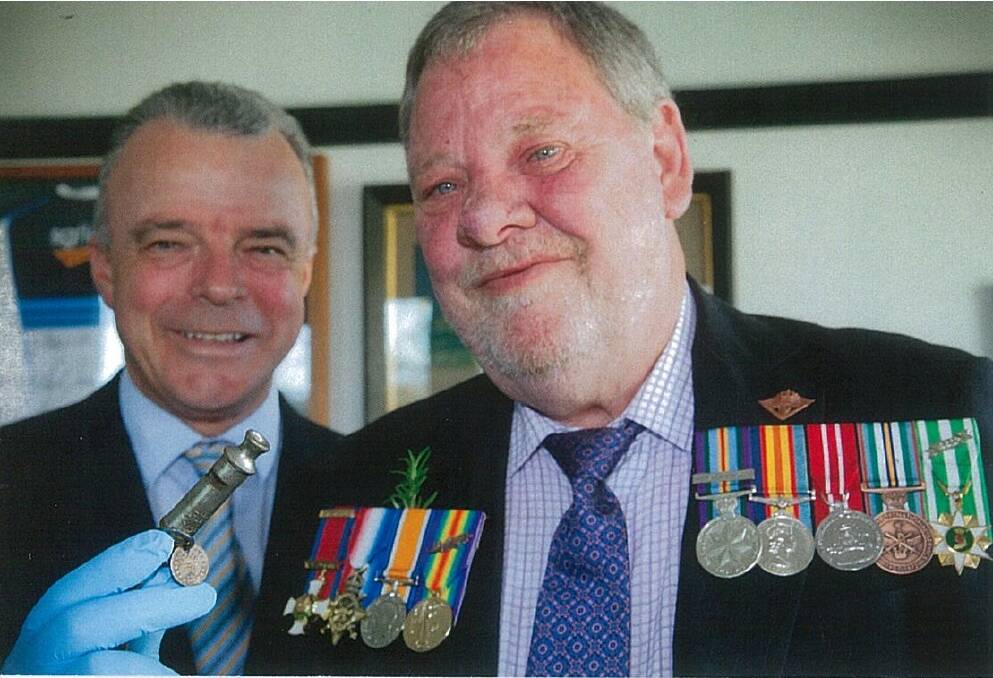 PORTLAND’S Ian Burrett, right, with Australian War Memorial director Brendan Nelson and the whistle that
sent a chilling signal on the Gallipoli battlefield.