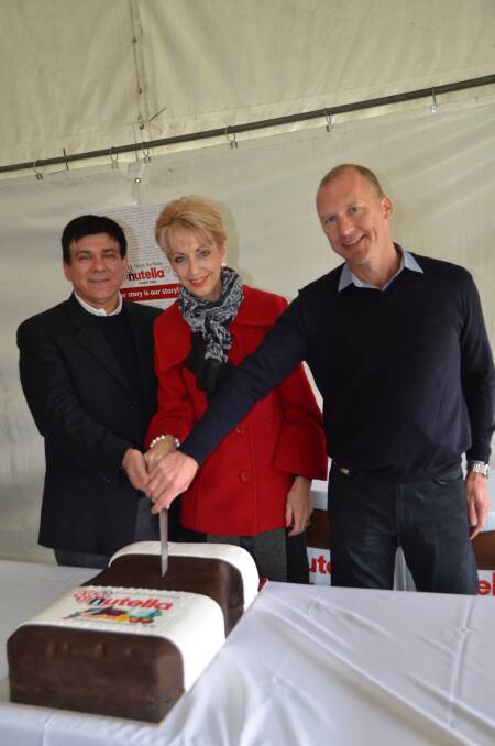 MAYOR Maree Statham joined with managing directors Francesco Farina and Craig Barker in cutting the birthday cake