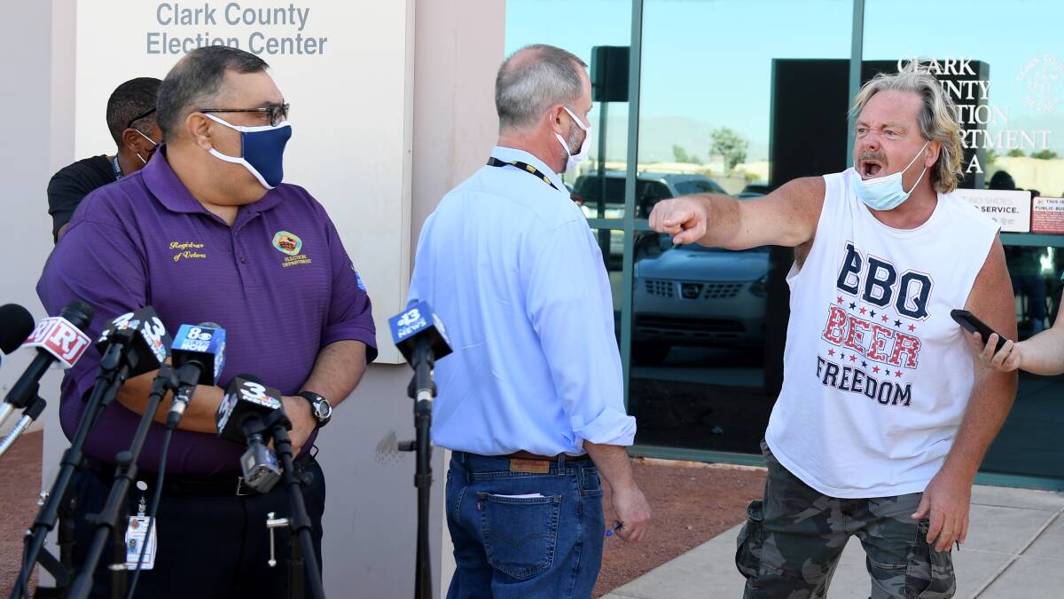 A protester interrupts Clark County registrar Joe Gloria at a press conference to discuss ballot counting in North Las Vegas, Nevada. Picture: Getty Images
