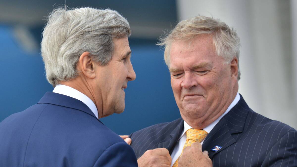 Former US secretary of state John Kerry (left) is greeted by Kim Beazley, Australia's then ambassador to the United States, in 2014. Picture: Getty Images