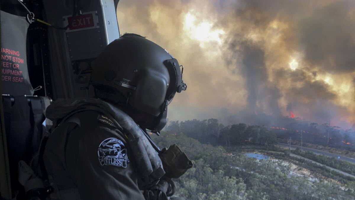 The fires burning in the Blue Mountains and Lithgow areas have caused service issues.
Photo: Australian Defence Force, Commonwealth of Australia