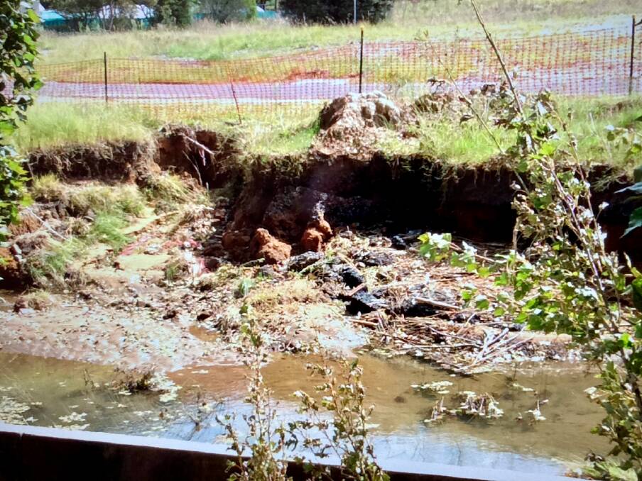 BREEDING GROUND: A flooded Farmers Creek has resulted in a stagnant water dam in a Coalbrook Street excavation with concerns over a mozzie explosion.
