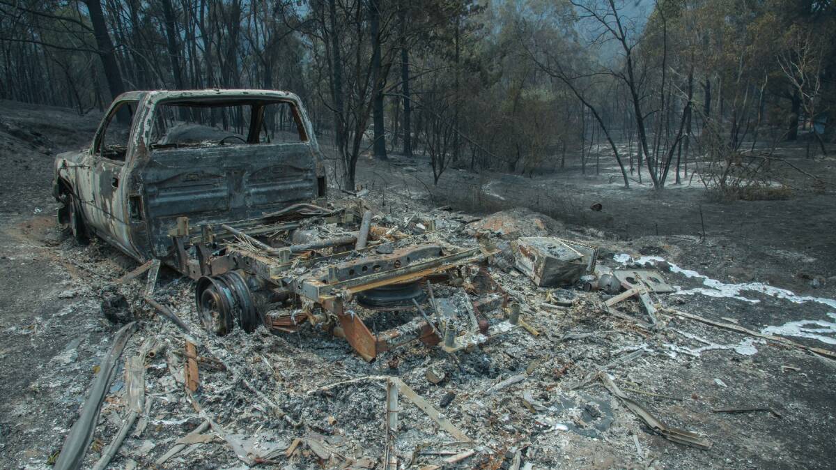 The shell of a burned-out car near Secret Creek in Lithgow. Photo: Merridy Cairn-Duff