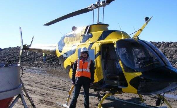 FUN: Diana Barnes standing in front of a helicopter before her first trip up in the air. Photo: SUPPLIED