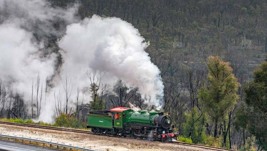  ALIVE AGAIN: Steam covered the air as the locomotive went around the tracks. Photo: CHRIS LITHGOW