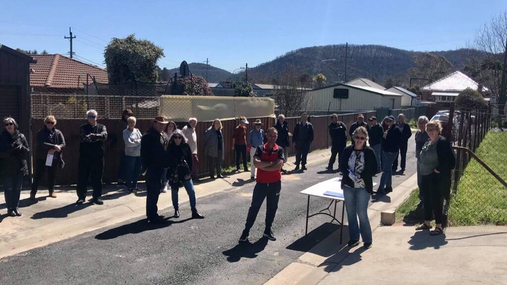 UNHAPPY: Neighbours gather in Lithgow to show their opposition to the plan. Photo: Len Ashworth