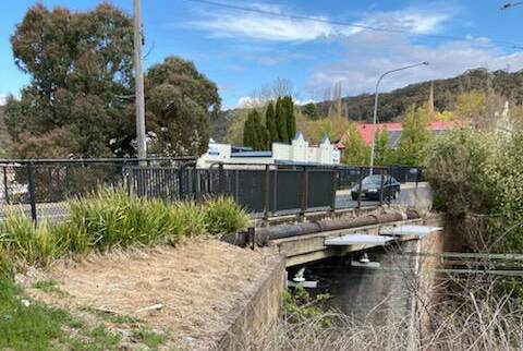 OUT OF SIGHT: A barrier fence was recently erected to protect pedestrians on Lithgow's Bridge Street rail bridge. Problem is the barrier has added to existing sight distance issues for motorists emerging from Railway Parade.