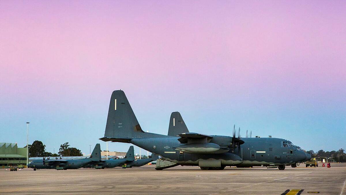 United States Air Force MC-130J Commando II aircraft (right) share the RAAF Base Richmond flightline with No 37 Squadron C-130J Hercules aircraft. CPL David Said