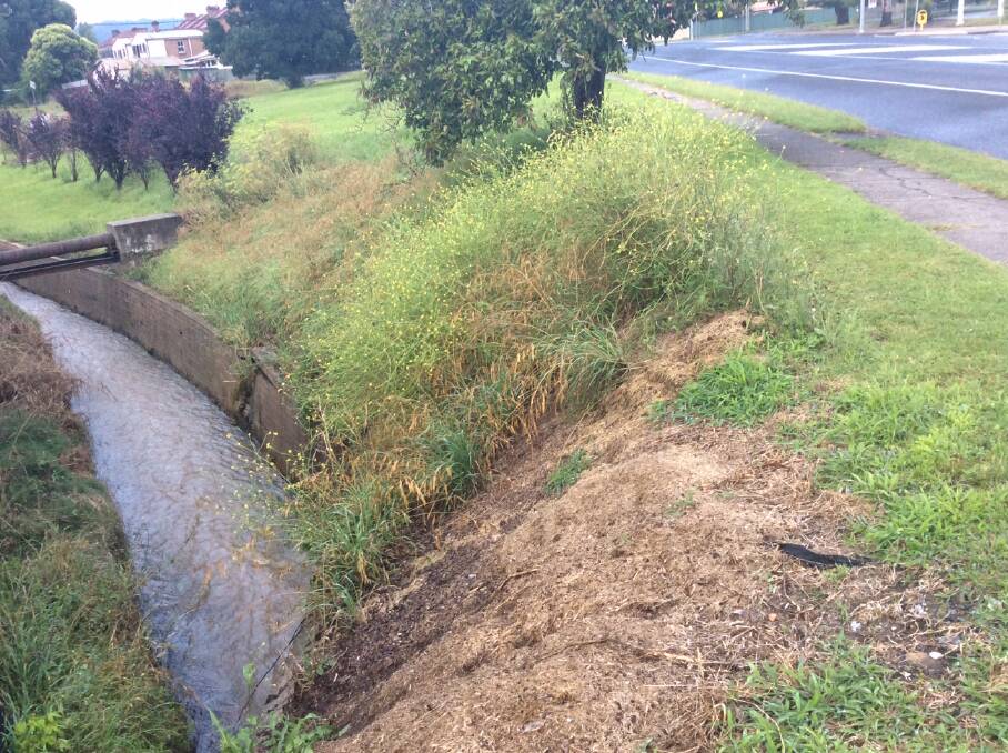 DANGER ZONE: Recent floods have highlighted the high risk posed by an unfenced canal metres from the Lithgow Street footpath.