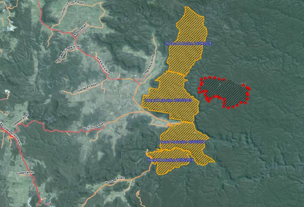 BLAZE: The active fire (within red dots) is located east of a number of hazard reduction burns that were conducted between mid-2013 and mid-2018. Image: NSW RFS