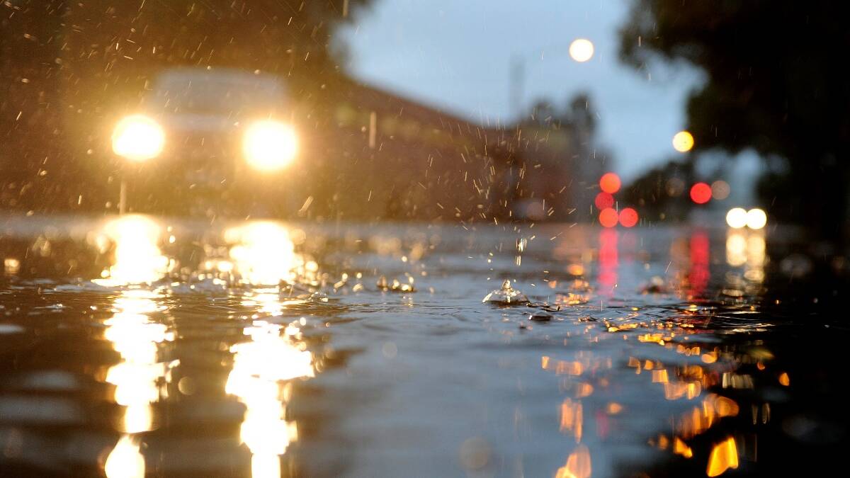 TAKE CARE: NSW Police officers are urging school holiday traffic to take care in the rainy conditions. Photo: FILE