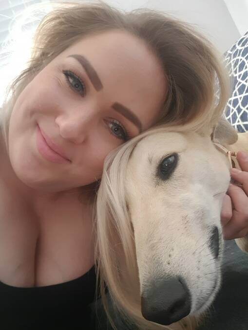 CARING: Greyhounds as Pets foster carer Elle Radford with retired dog Marnie. Photo: SUPPLIED