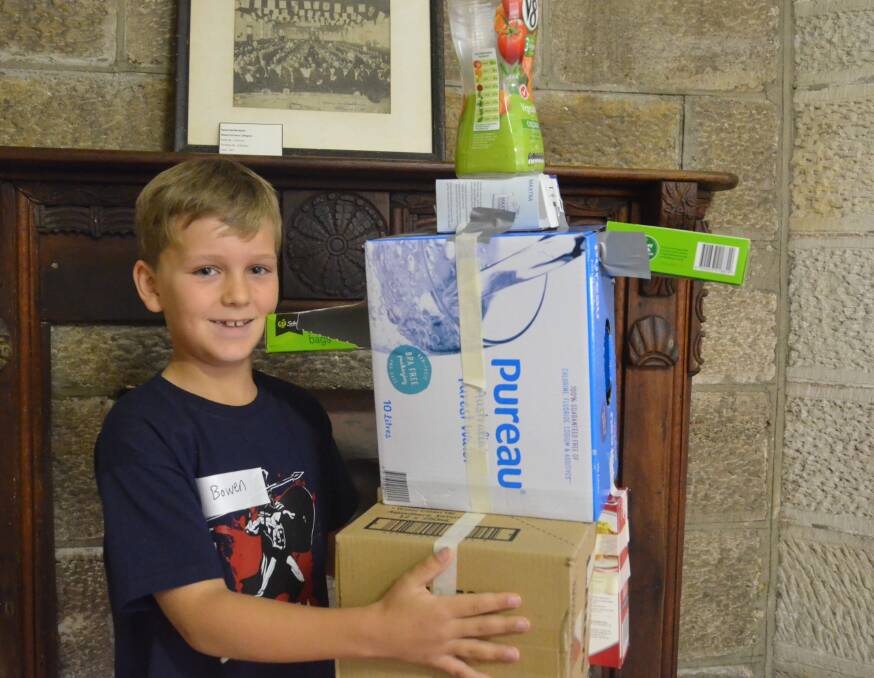 RECYCLED ROBOT: 8-year-old Bowen Hine is from Taree and visiting family in Lithgow for the school holidays. PHOTO: Jacob Gillard. lm092916esk