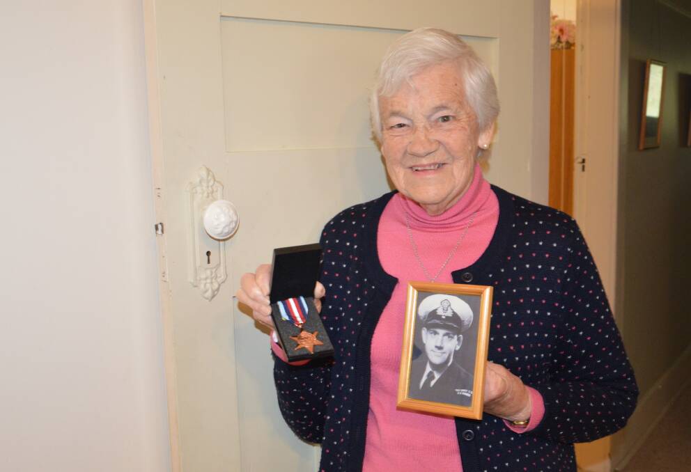 REMEMBERING ALEC: Rosemary Stanley stands proudly with a photo of her late husband Alec who served in the Royal Navy in WWII and his Arctic Star medal. Photo: ALANNA TOMAZIN.