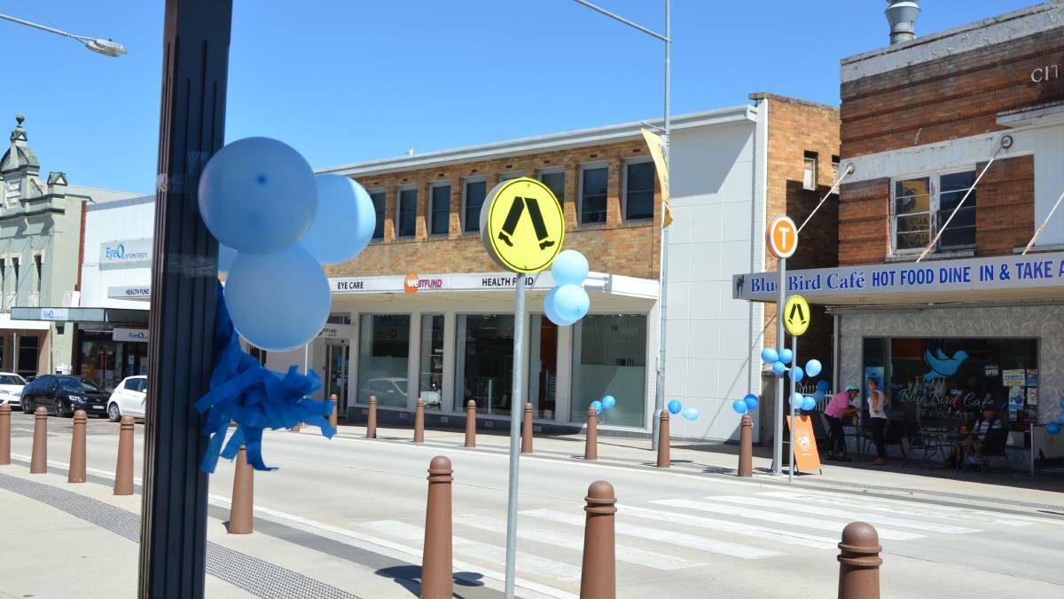 LITHGOW TURNS BLUE: Local businesses displayed blue balloons as a sign of respect on the day of Kelly's funeral. 